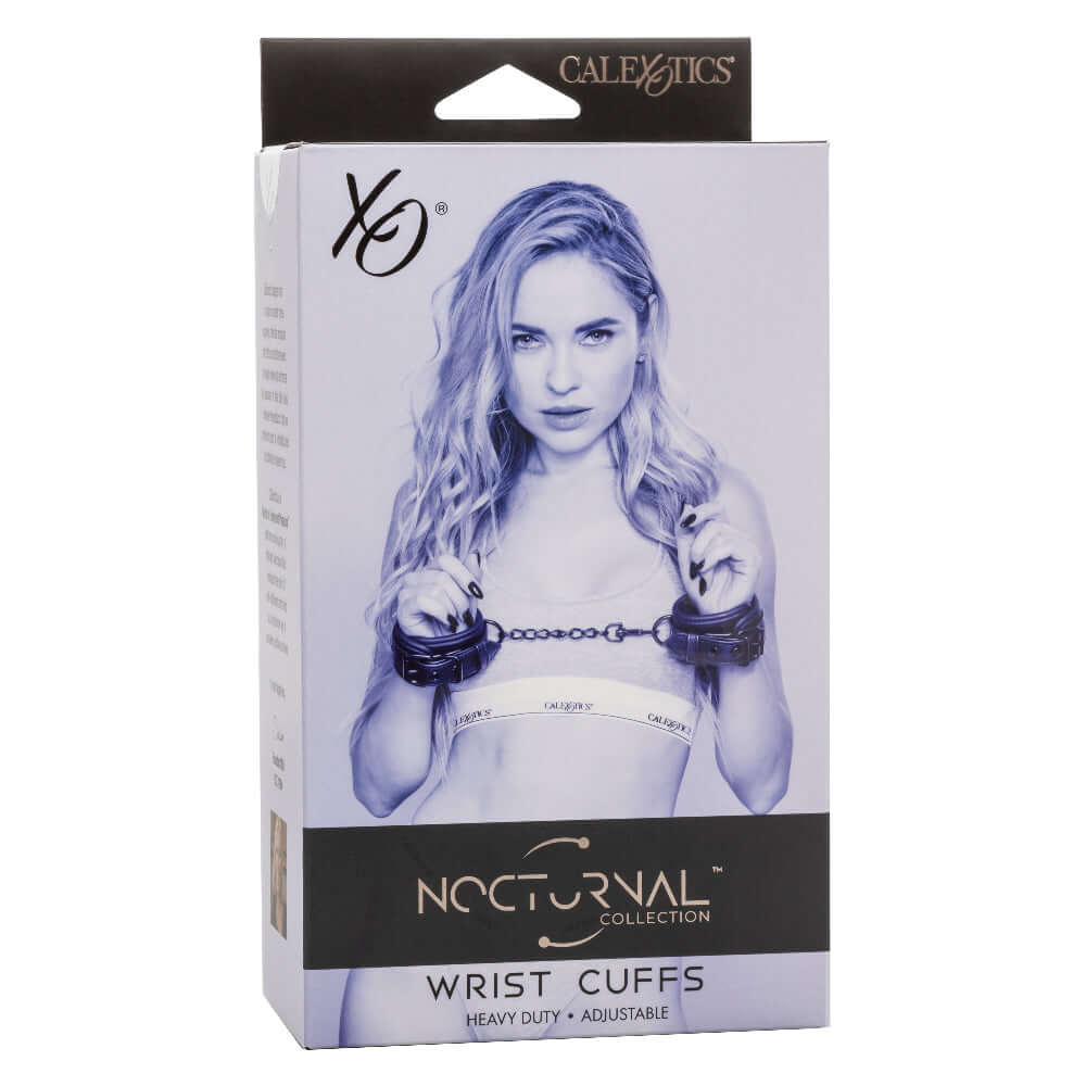 Packaging for Nocturnal Collection Wrist Cuffs - Black with model showcasing adjustable wrist cuffs and metal chain.