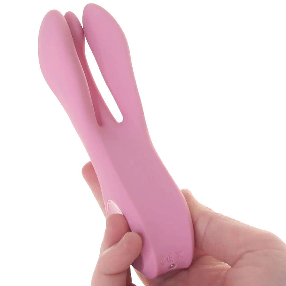 Hand holding the Threesome 1 Pink Vibrator, showcasing its sleek design and curves for enhanced pleasure.