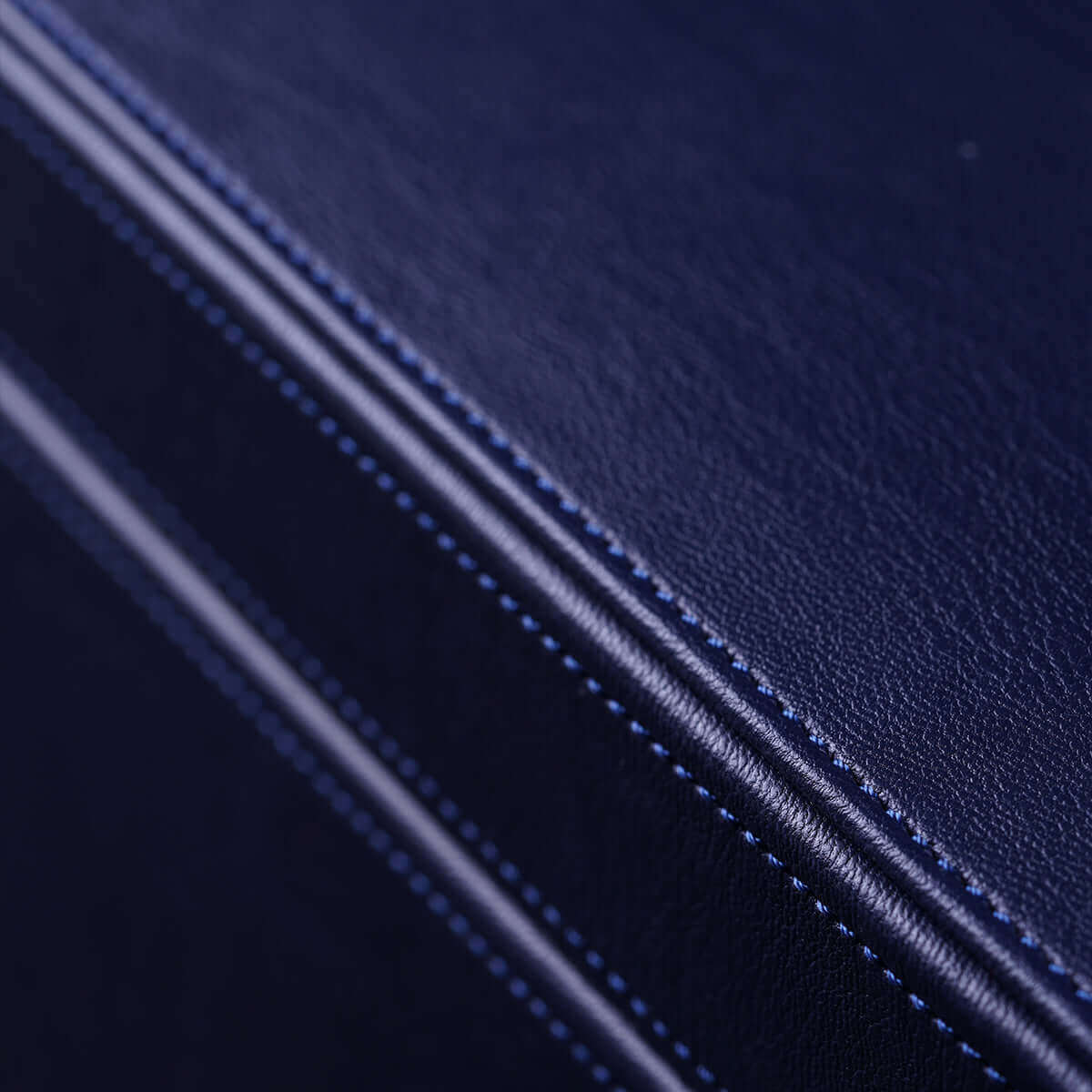 Close-up of the premium textured faux leather exterior of the UPKO Black Label Deluxe Kit storage case.