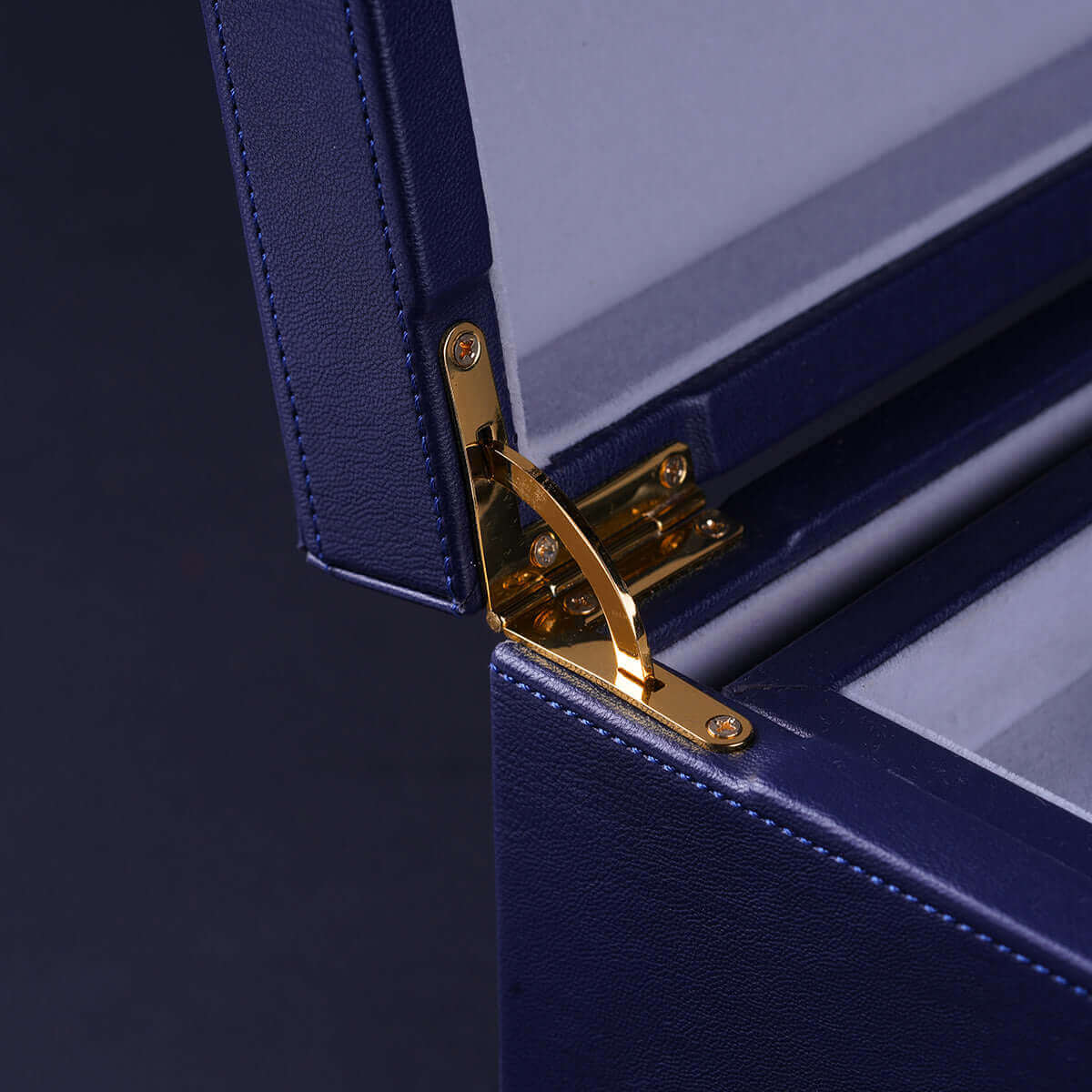 Close-up of UPKO Black Label Deluxe Kit hinge, showcasing premium faux leather and gold hardware detail.