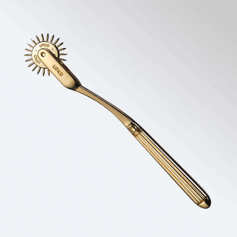 UPKO Spiked Metal Pinwheel in gold, designed to stimulate nerves with high-end zinc alloy material.