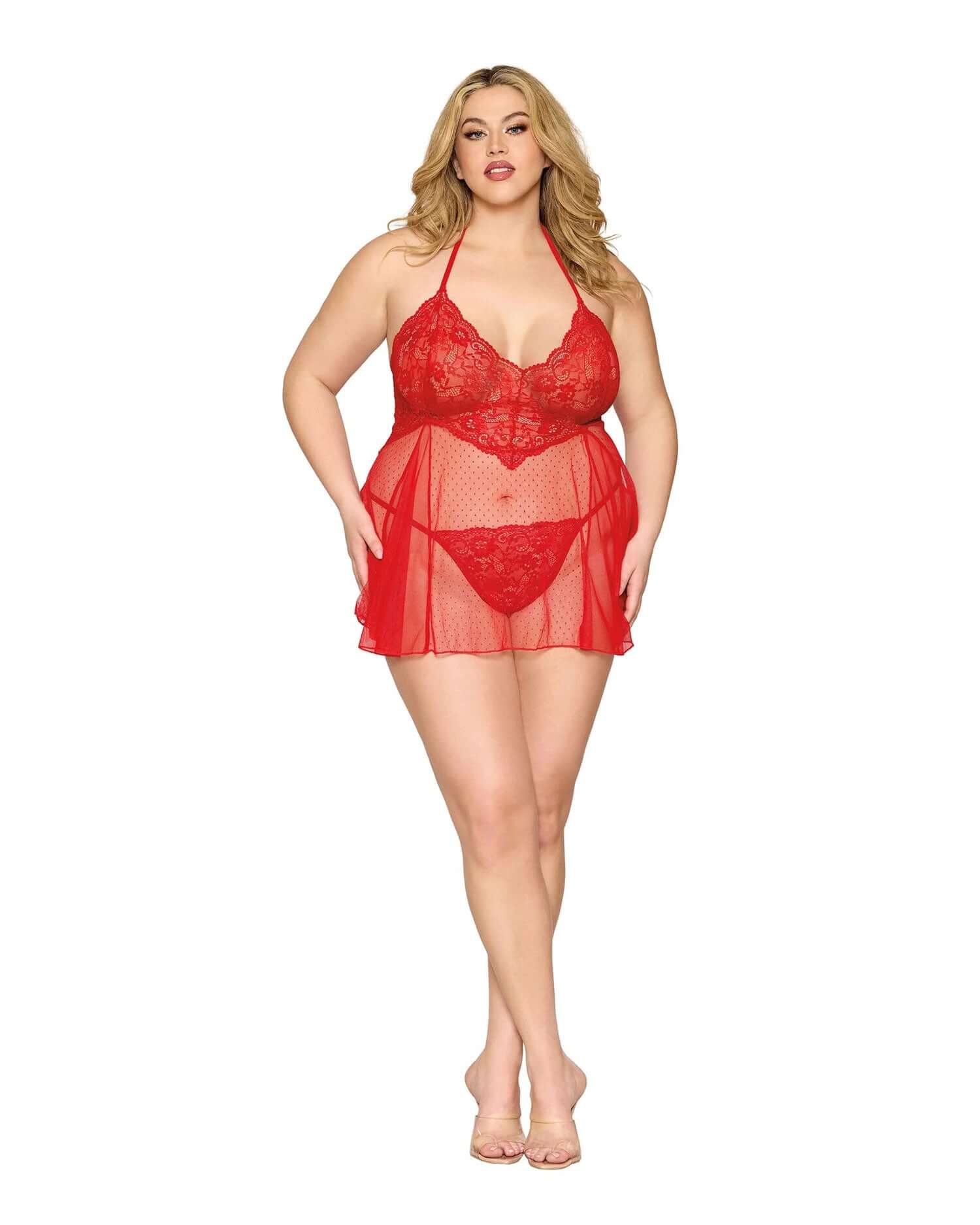 Plus-size model wearing Dreamgirl red babydoll and g-string lingerie set, made of 90% nylon and 10% spandex, front view.