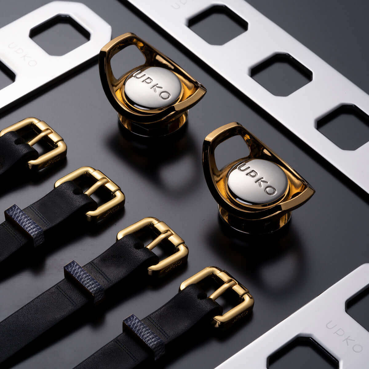 UPKO Black Label Deluxe Kit components featuring premium gold and black straps with elegant design elements.