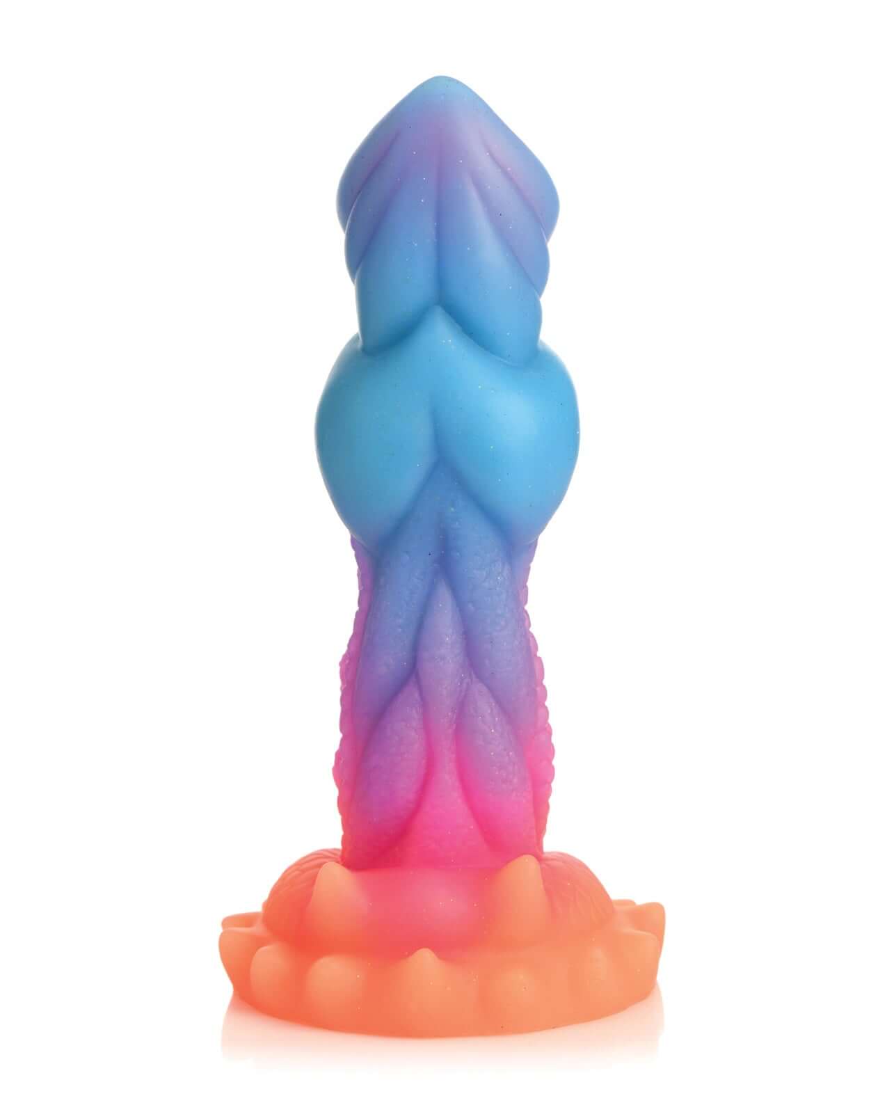 Aqua-Cock glow-in-the-dark silicone dildo in layered blues, oranges, and pinks with a detailed, textured design.