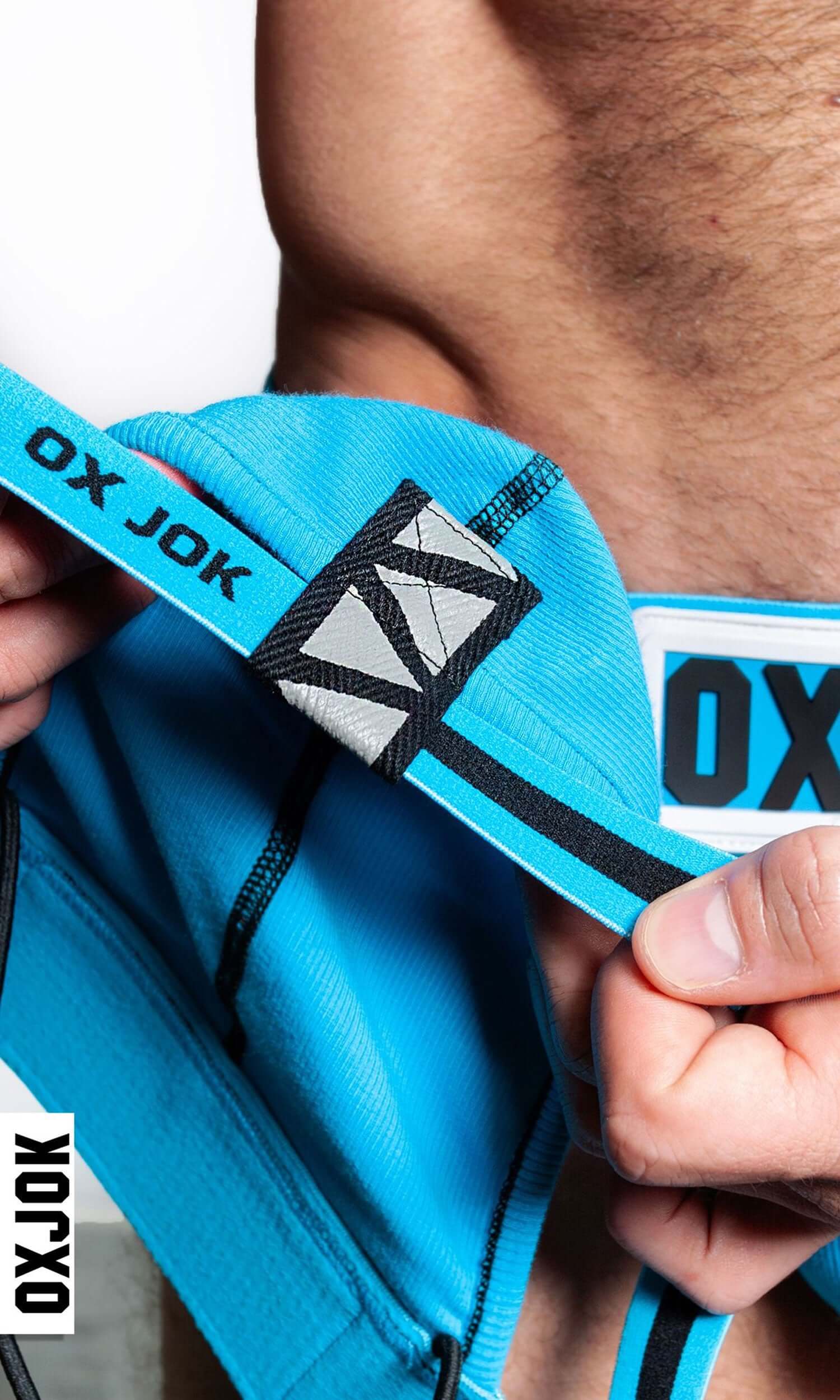 Close-up of Oxjok blue slider-strap jock showcasing durable waistband and design details for maximum comfort and support.