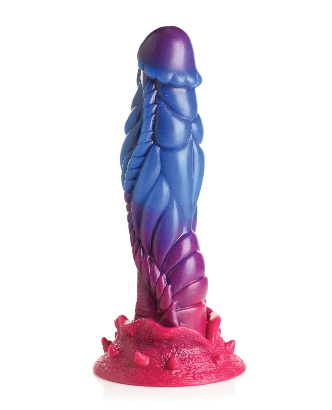 Alien silicone dildo in blue, purple, and pink colors with glitter, featuring a textured design with large bumps and roped lines.