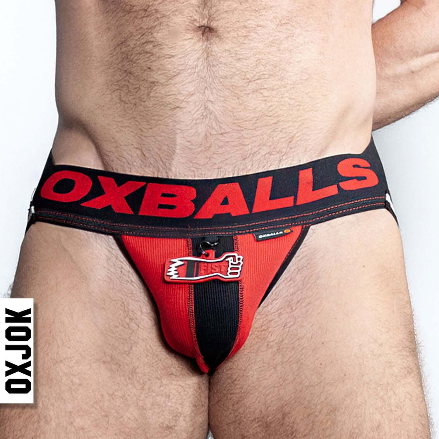 Man wearing Fisterjock 3D Fist Tagger Jock Black/Red XL with Oxjok branding