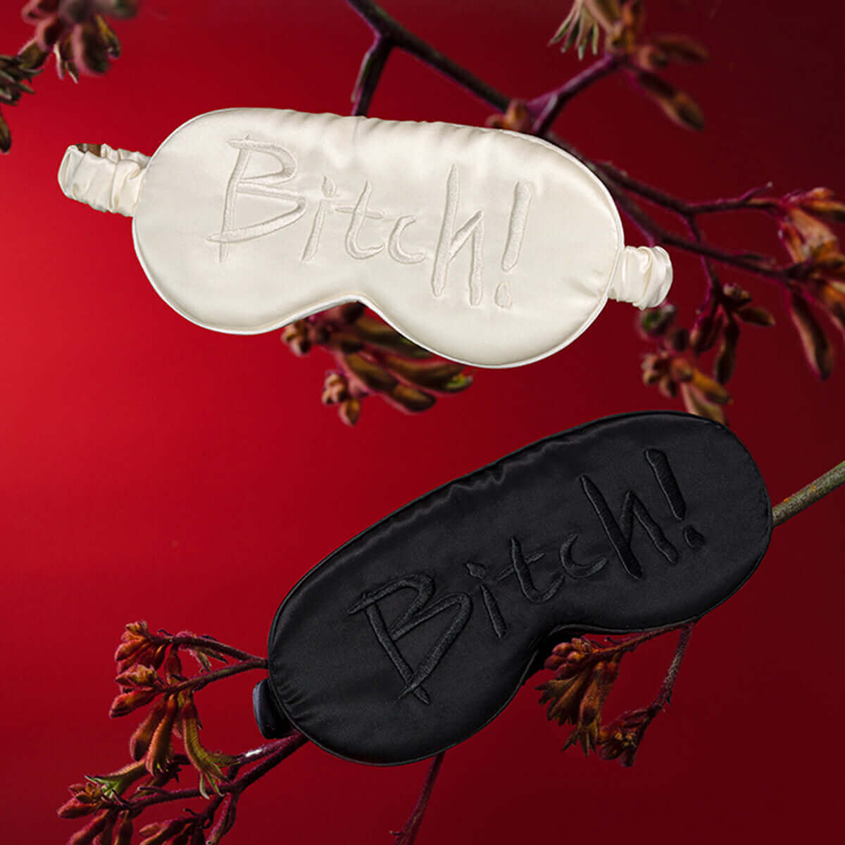 UPKO embroidered silk blindfolds in white and black, featuring the word "Bitch!" for stylish sleep and relaxation.