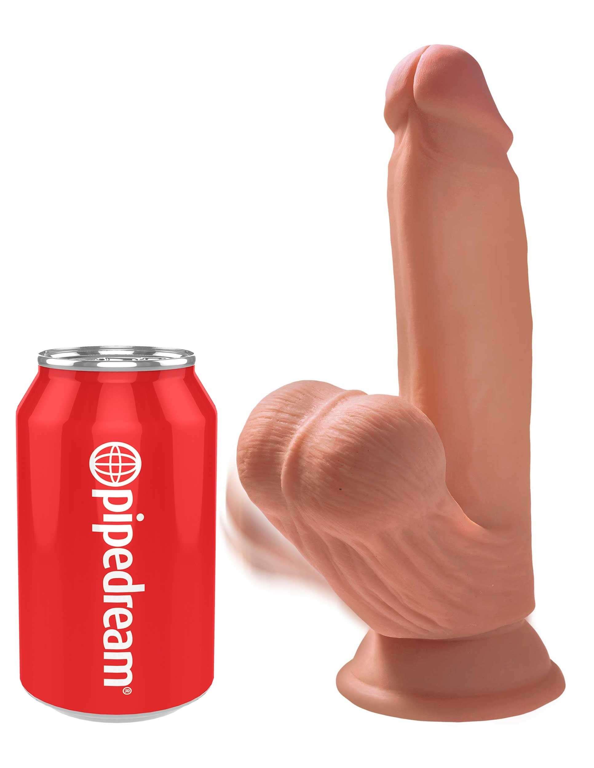 7 Inch Triple Density Tan Dildo next to a soda can for size comparison, showcasing realistic design and swinging balls.