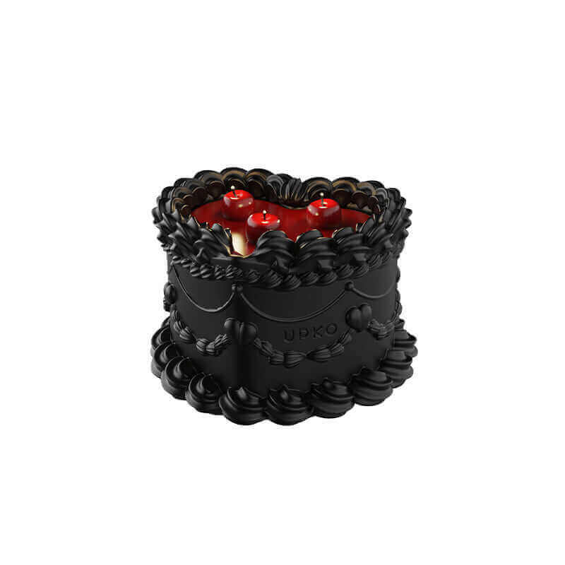 Midnight Sweetie low-temperature wax candle designed to look like a cake, featuring red and black colors with cherry details.