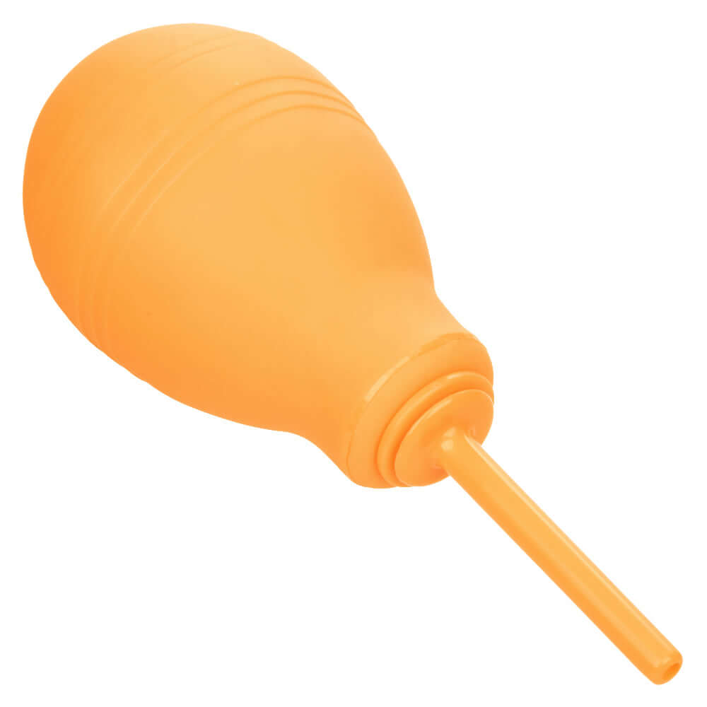 Cheeky One-Way Flow Douche in orange with a slender nozzle for efficient and hygienic cleaning.