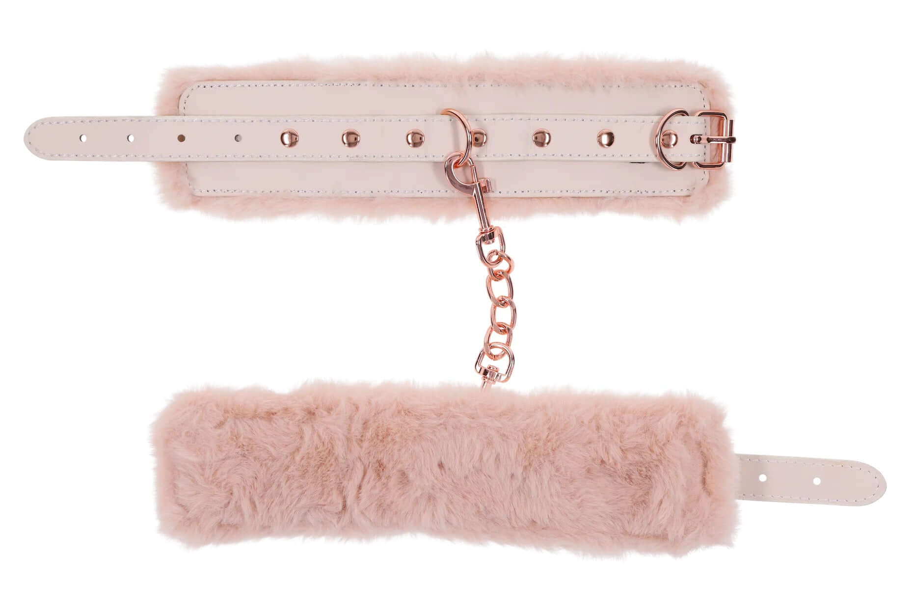 Peaches ‘N Creame pink faux fur handcuffs with soft peach-colored fur and a subtle shimmer, connected by a delicate golden chain.