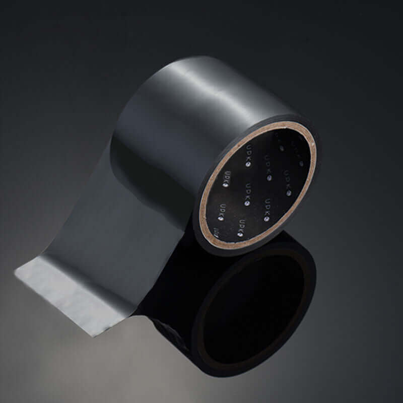 UPKO Standard Static Bondage Tape roll in black color on a reflective surface, showcasing its PVC material and flexible design.