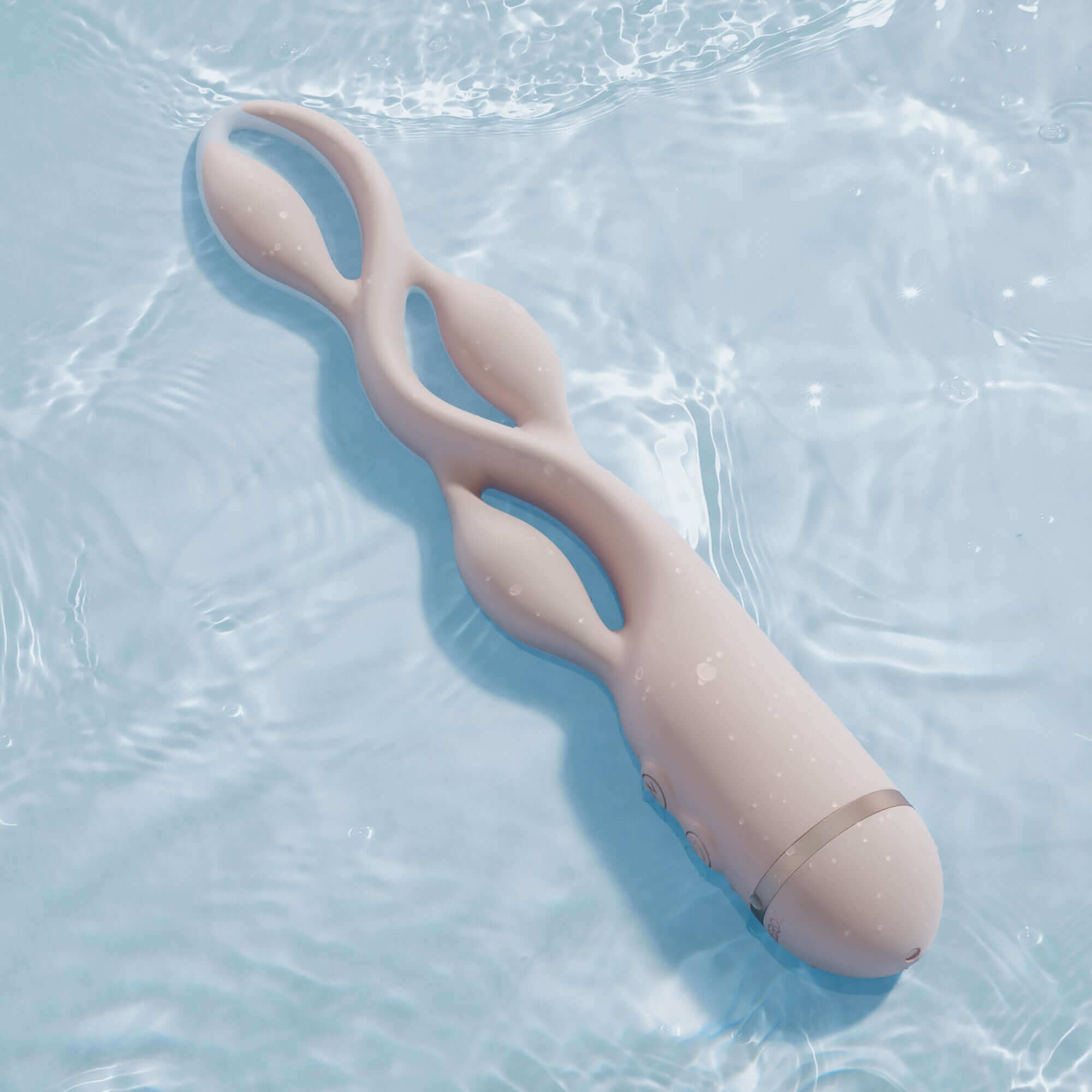 UEROS Multi-motor Pulse Vibrator in pink with unique design and pulse vibration, floating in water for enhanced pleasure experience.