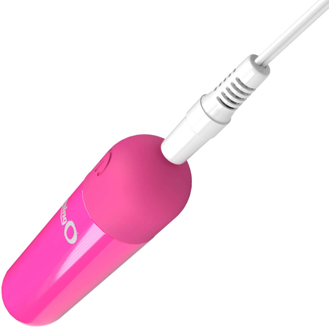 Pink Screaming O Rechargeable Bullet being charged, showcasing its compact design and powerful motor for customizable pleasure.