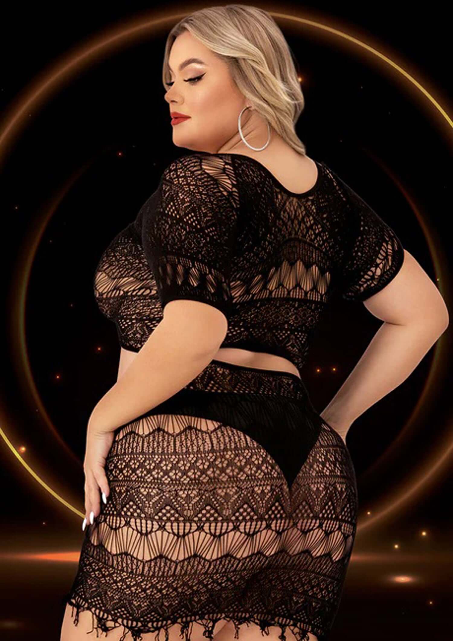 Black lace crop top and skirt set in queen size, highlighting a seductive midriff and bold curves.