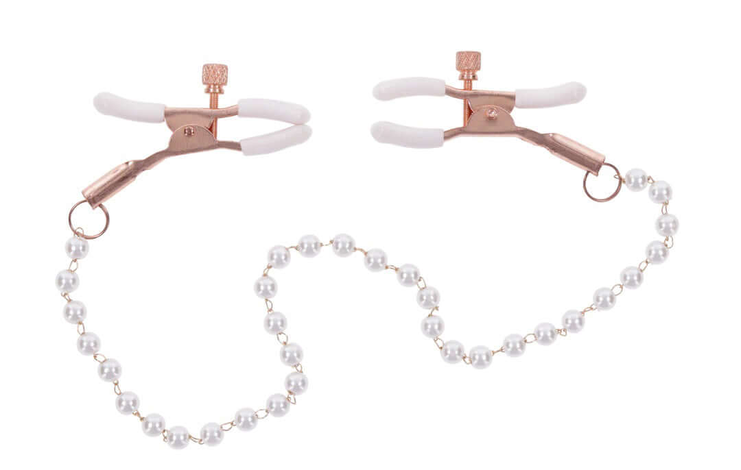 Rose gold nipple clamps with pearl chain and white rubberized tips for enhanced sensitivity and playful teasing.