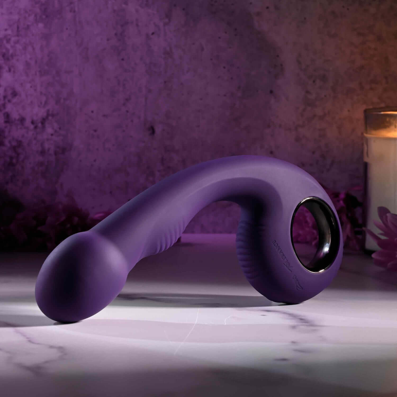 Rip Curl Rechargeable Vibrator in purple, showcasing textured handle and bulbous head, set against a soft-lit background.