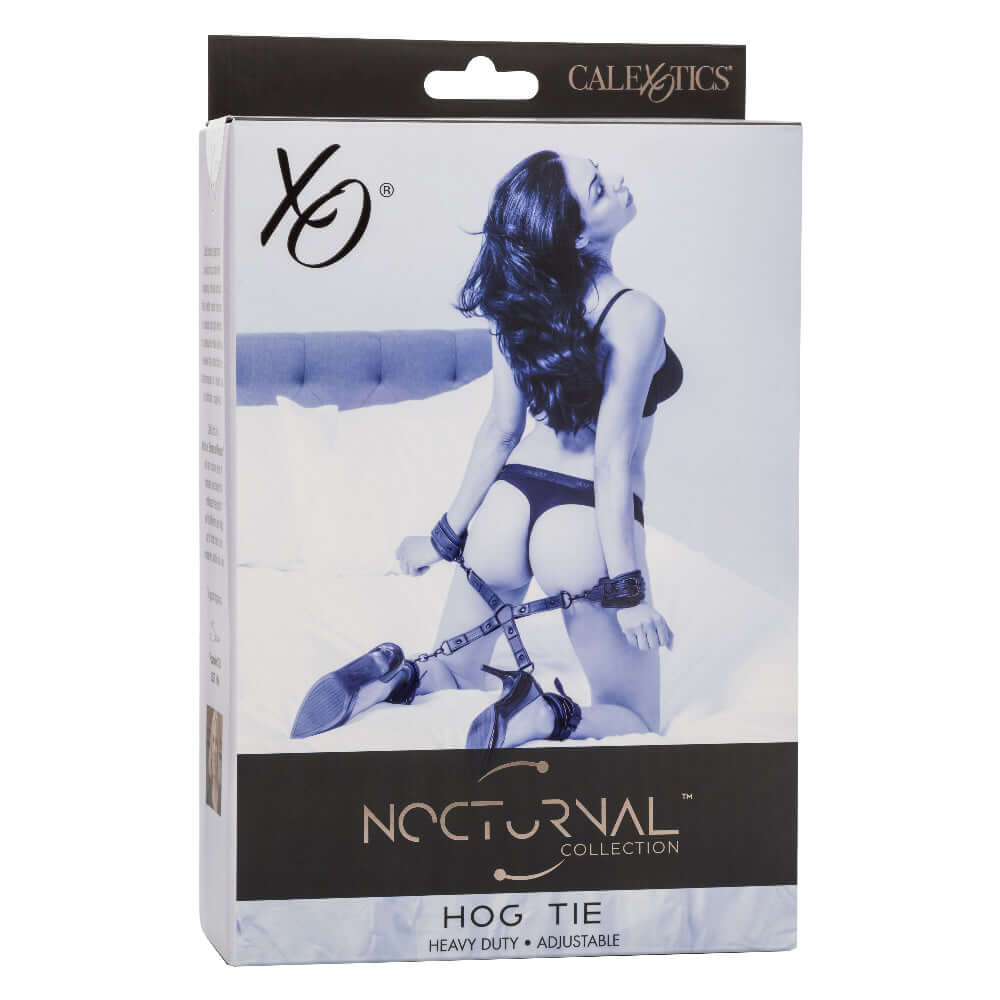 Packaging of Nocturnal Collection Hog Tie in black featuring a woman restrained with adjustable cuffs