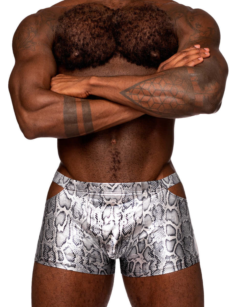 Man wearing S'naked Pouch Short in silver/black metallic snake print with cut-out windows, showcasing a sleek and snug fit