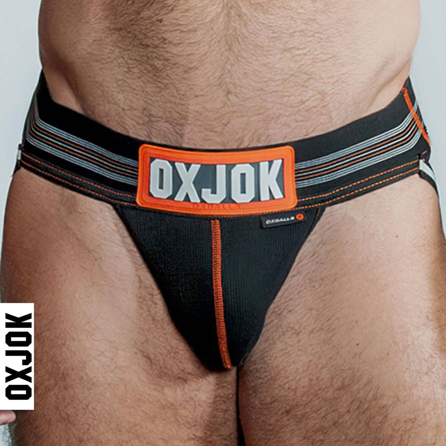 Oxjok Slingjock Upthrust Slider-Strap Jock Black Iron Medium shown worn, highlighting waistband and pouch.