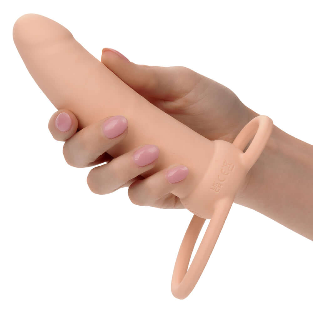 Performance Maxx Rechargeable Thick Dual Penetrator in ivory color held in hand