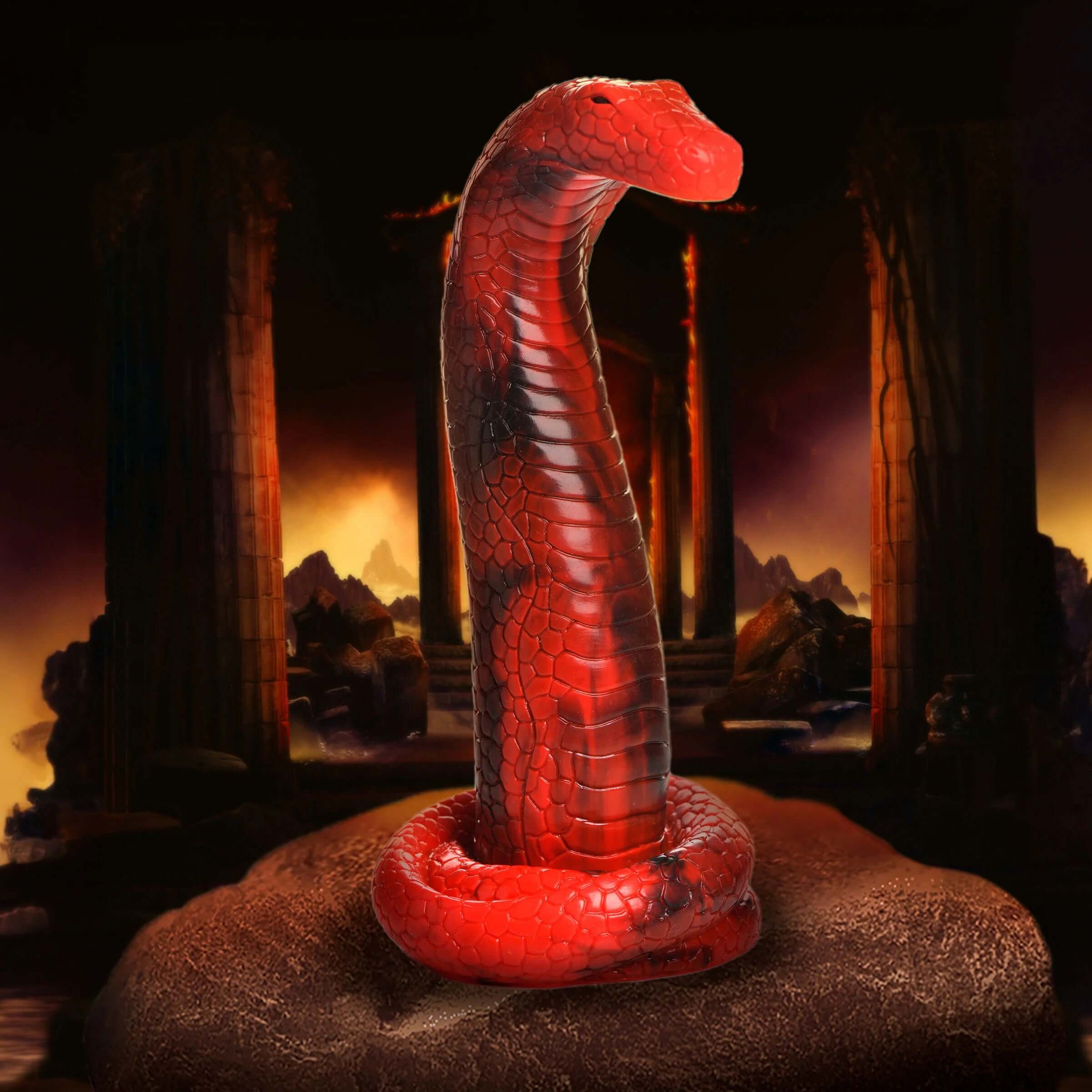 Red and black King Cobra silicone dildo with textured scales and tapered head for enhanced pleasure, standing upright in a dramatic background.