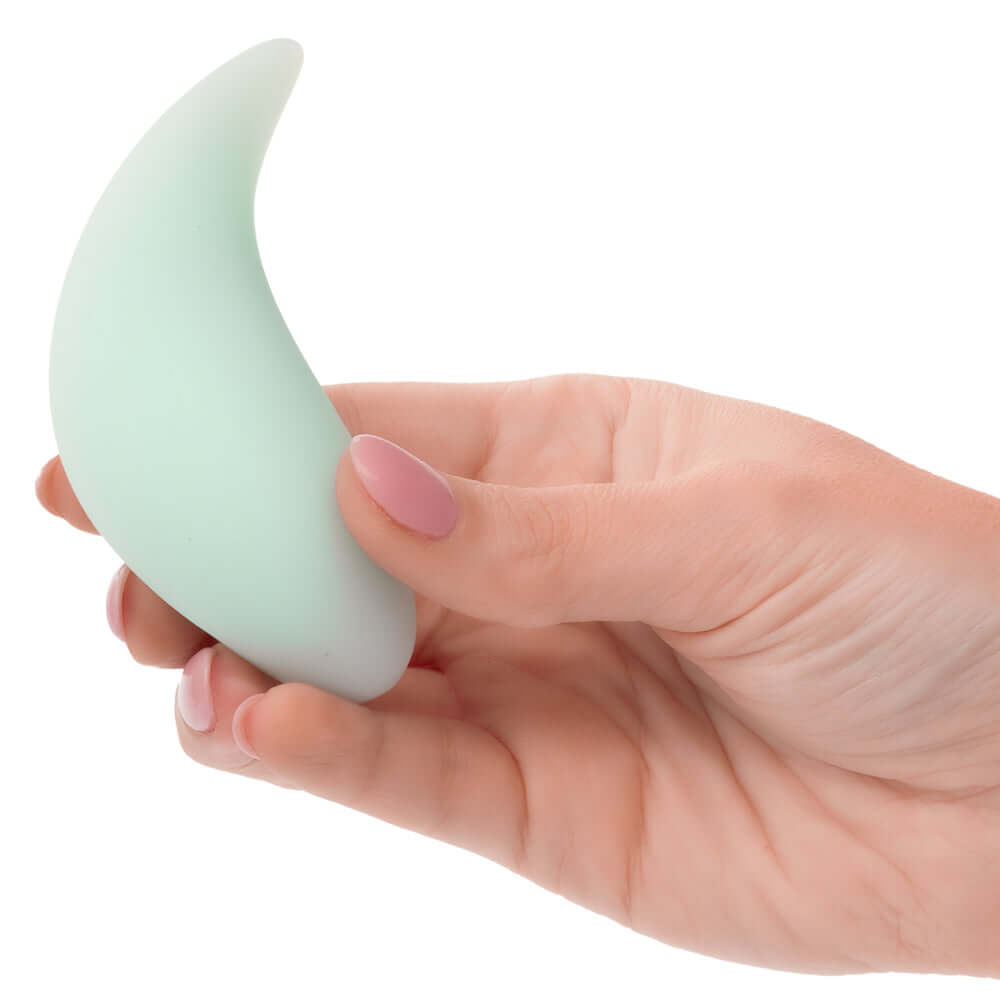 Hand holding Pacifica Bali Massager in green for elegance and intense stimulation.